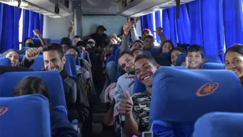 AFP A group of Venezuelan migrants travelling to Peru by bus, make a stop in the outskirts of Quito