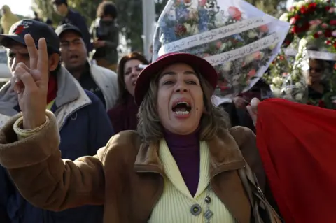 EPA Tunisian woman mourns during the funeral of the Human rights defender, internet-activist, and blogger Lina Ben Mhenni, who was previously nominated for the Nobel Peace prize in Tunis, Tunisia, 28 January 2020