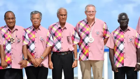 EPA Kiribati's President Taneti Maamau, Cook Islands Prime Minister Henry Puna, Tonga's Prime Minister Akilisi Pohiva, Australia's Prime Minister Scott Morrison and Solomon Islands Prime Minister Manasseh Sogavare pose for a group photo at the Pacific Islands Forum in 2019