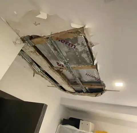 53 Agar Grove residents Ceiling panel exposed