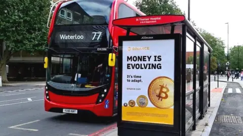 Binance A Binance bus shelter ad near St Thomas' Hospital in London