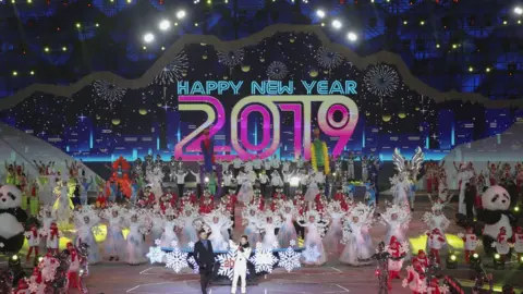 Lintao Zhang/Getty Images  Chinese people celebrate during a New Year's Eve ceremony in Beijing, China, 31 December 2018