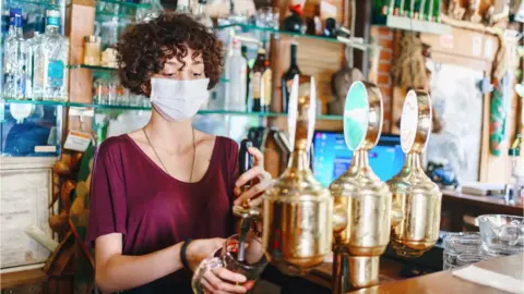 Getty Images A pub worker