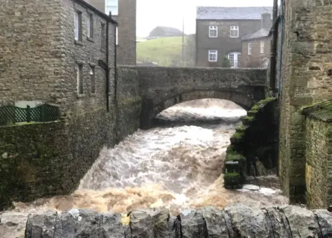 @bezberesford via PA Flooding caused by heavy rainfall in Hawes, North Yorkshire in 2020