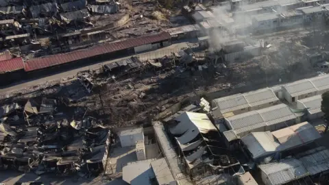 Reuters An aerial view of destroyed shelters following a fire at the Moria camp for refugees and migrants on the island of Lesbos