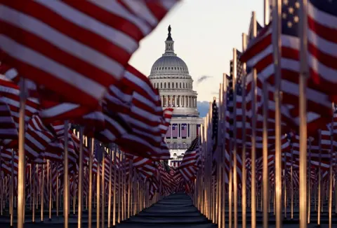 Reuters The "Field of flags" is seen on the National Mall in front of the U.S. Capitol building ahead of inauguration ceremonies for President-elect Joe Biden in Washington DC. 20 January 20, 2021.