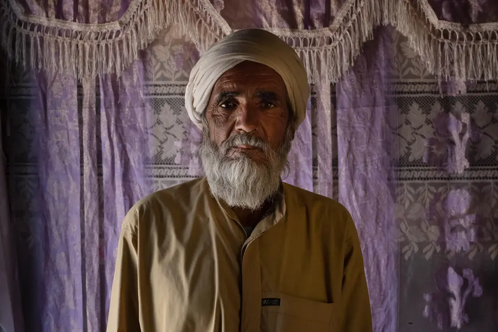 BBC Abdul Aziz at his home in Shesh Aba. Image: Julian Busch/BBC