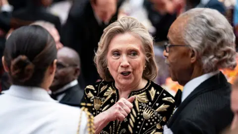 EPA Hillary Clinton (C), former US secretary of state, speaks with Reverend Al Sharpton (R), founder and president of the National Action Network, during a state dinner at the White House in Washington, DC, US, 23 May 2024.