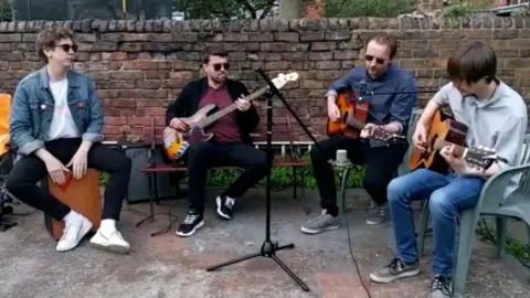 YouTube Jacob Billington (left) and Michael Callaghan (second from right) performing in their band