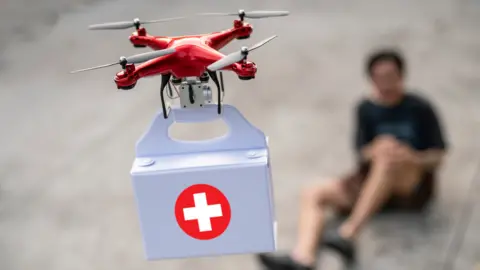 Getty Images First aid kit being delivered by drone