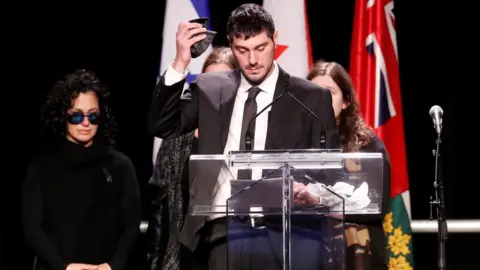 Reuters Jonathan Sherman takes his yarmulke off