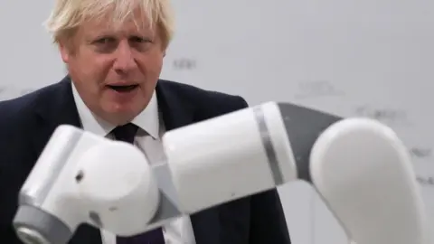 PA Media Boris Johnson during a visit to Tharsus headquarters in Blyth, Northumberland