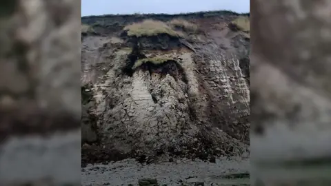 A coastal cliff collapsing.