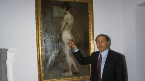 Umberto Cicconi/Getty Silvio Berlusconi is seen with a painting