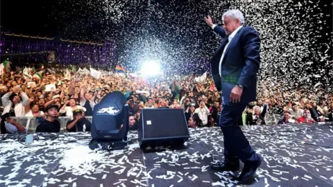 AFP Newly elected President Andres Manuel Lopez Obrador cheers his supporters at the Zocalo Square after winning general elections, in Mexico City, on July 1, 2018
