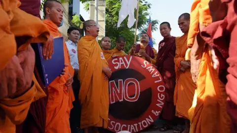 AFP Cambodian Buddhist monks chant during a protest against the NGO law in front of the Senate building in Phnom Penh