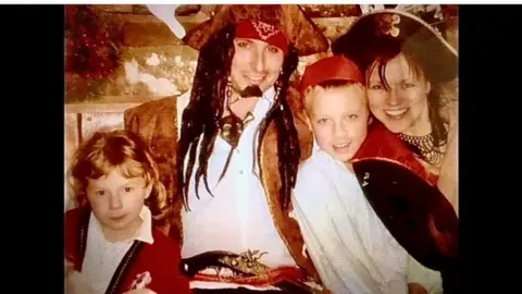 Mum Salli, husband Jamie, Millie and Jackson dressed as pirates