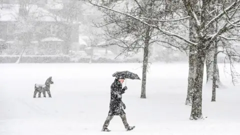 Getty Images Person walks through Victoria Park in Glasgow