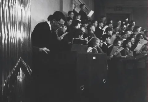 Alice Faure / Decca Records The boys choirs can be seen rehearsing with Britten in this photo from 1963