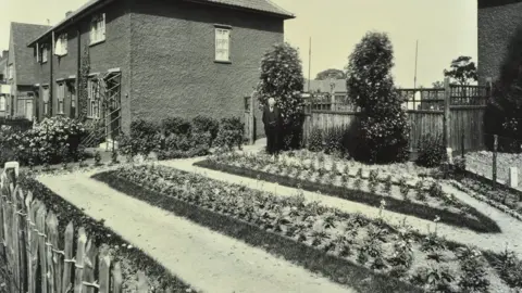 Heritage Images/Getty Garden at 187 Valence Wood Road, Becontree Estate, Ilford, London, 1929