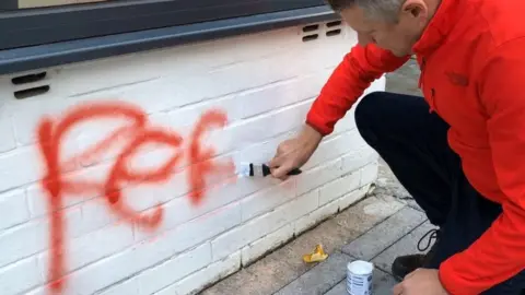 Luke Pollard Luke Pollard cleaning wall