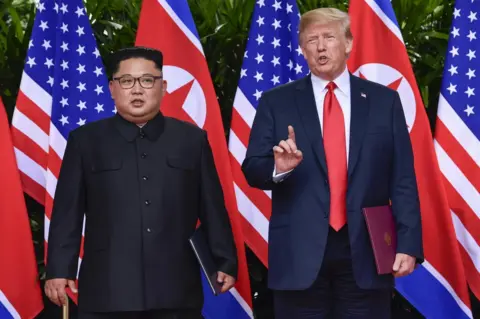 Susan Walsh / Getty Images US President Donald Trump and North Korea leader Kim Jong-un pose for press