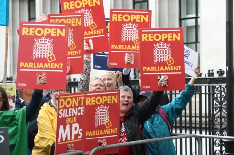 PA Media Protesters celebrating outside the Supreme Court in London, where judges have ruled that Prime Minister Boris Johnson's advice to the Queen to suspend Parliament for five weeks was unlawful.