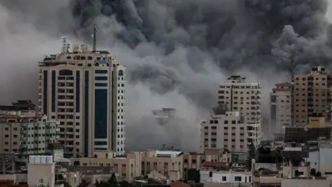 EPA Smoke rises following an Israeli air strike on Gaza City, 09 October 2023.