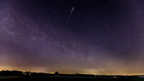 Getty Images A meteor of the lyrids in the sky is seen on 22 April, 2020 in Schermbeck, Germany