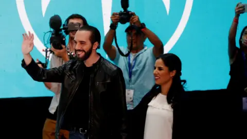 EPA Nayib Bukele and his wife Gabriele de Bukele greet supporters in San Salvador, El Salvador, 3 February 2019