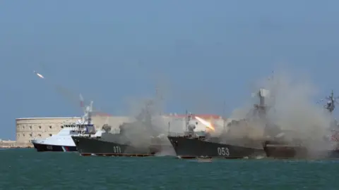 AFP Russian frigates fire missiles on Navy Day at Sevastopol in the annexed Crimea