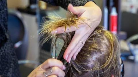 Getty Images Cutting hair