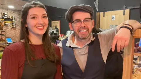 Alex Pope/BBC Vincent Decamps and a co-worker at one of the owners of Maison Le Vôtre Bedford