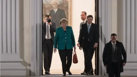 EPA Mrs Merkel leaves after talks on Thursday