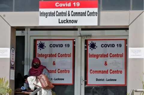 Reuters A woman registers details to get a hospital bed for her relative who needs treatment for the coronavirus disease at the COVID-19 Integrated Control and Command Centre in Lucknow, India, April 20, 2021.