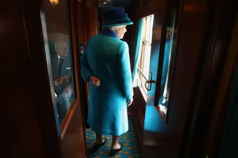 Getty Images Queen Elizabeth travels on a steam train to inaugurate the new £294m Scottish Borders Railway