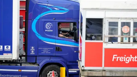 Getty Images Trucks arrive at the Holyhead ferry terminal on January 01