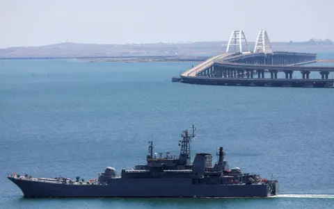 Reuters A Russian Navy amphibious landing ship that was deployed to transport cars across the Kerch Strait, moves near the Crimean Bridge