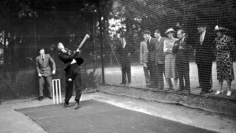 Getty Images Prince Philip playing cricket for National Playing Fields Association event in Woodford Green (1949)