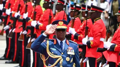 Getty Images Chief of Kenya Defence Forces General Francis Ogolla (C) gestures as Britain's King Charles III (unseen) and Kenyan President William Ruto (unseen) arrive at the tomb of the Unknown Warrior during a wreath laying ceremony at Uhuru Gardens in Nairobi on October 31, 2023.