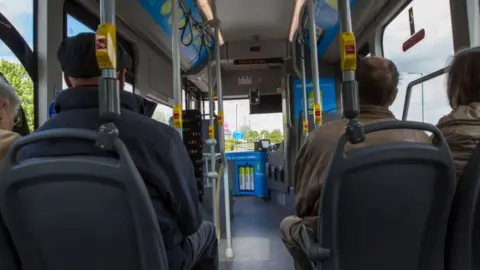 Getty Images Passengers on a bus