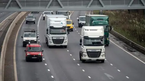 National Highways Lorries and cars on a motorway