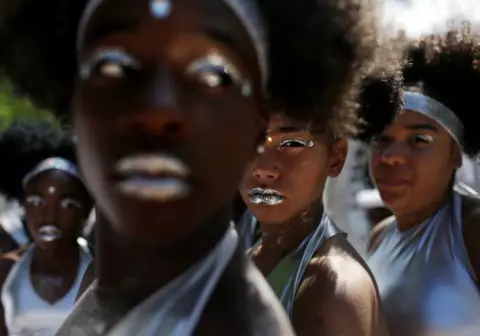 Yana Paskova/Getty Images A collection of models with silver lips.