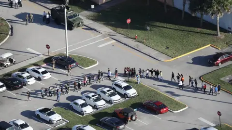 Getty Images Students led from the scene of the shooting