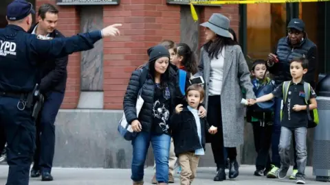 Reuters Parents pick up their children from school