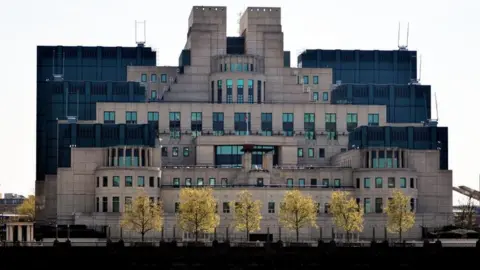 PA Media The headquarters of MI6