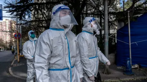 Getty Images File photo of Covid officials in China