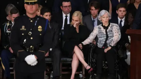 Getty Images Roberta McCain (R), the mother of the late US Senator John McCain, and granddaughter Meghan McCain (C) at the US Capitol on 31 August 2018