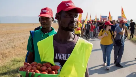 AFP/Getty African migrant workers marching on Foggia in protest at their labour conditions