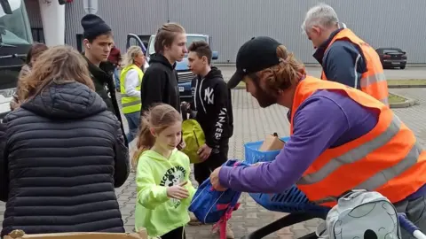 Stuart Thomas /PA Backpacks being give to Ukrainian children